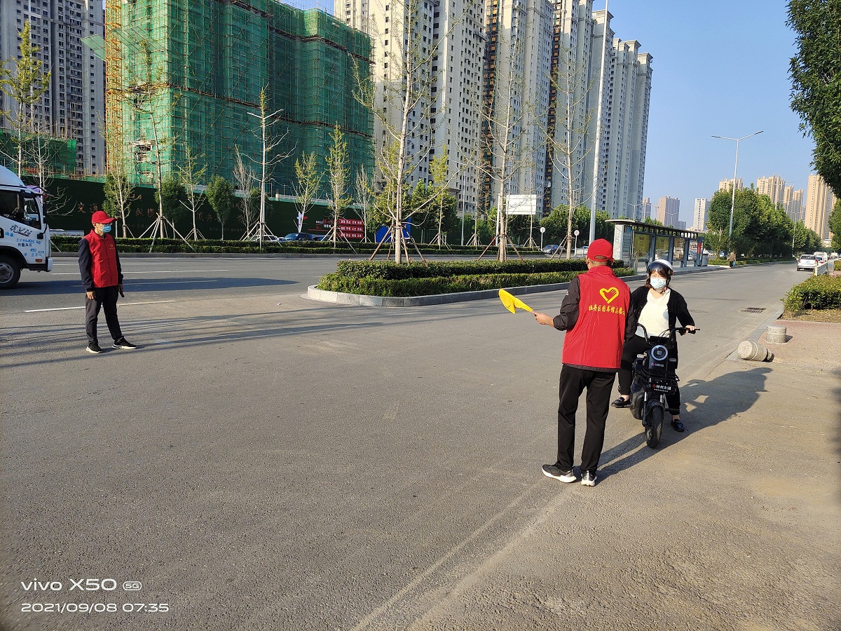 压缩.2021-9-8上午文明交通志愿服务_黄河太原路口 (13).jpg