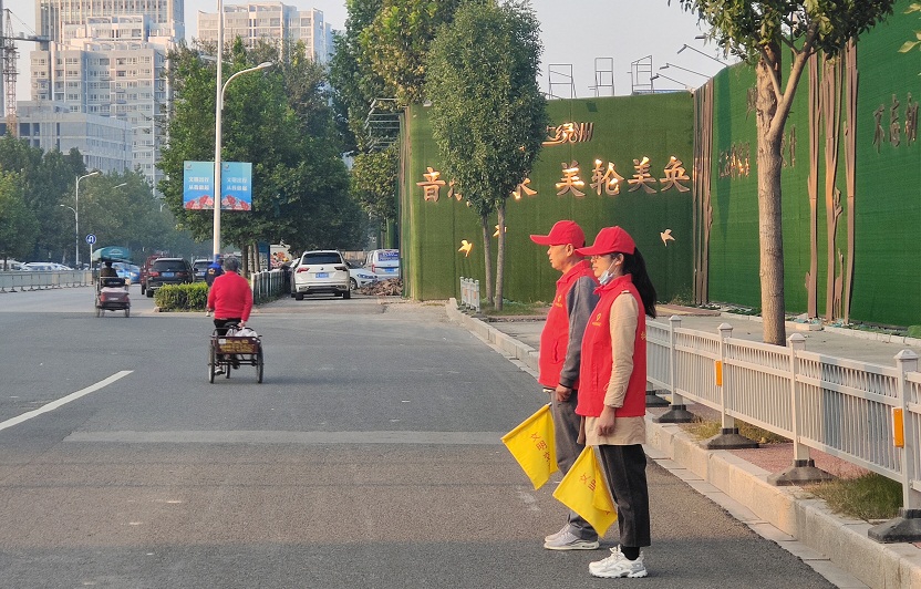 压缩.2021-10-13下午文明交通志愿服务_丹阳牡丹路口 (7).jpg